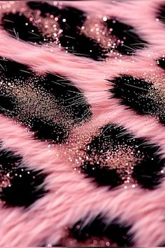 pink and black animal print fabric with glitters on the fur pattern, closeup