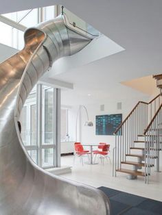 a slide in the middle of a living room