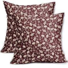 two brown and white pillows sitting next to each other