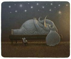 an elephant laying on top of a bench next to a mouse