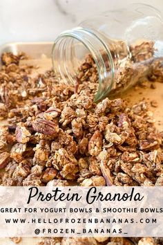 granola in a glass jar on top of a cutting board with the words, protein granola great for yogurt bowls and smoothie bowls