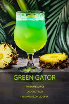 the green gator cocktail is served in a glass with pineapple juice, coconut rum and midori melon liqueur