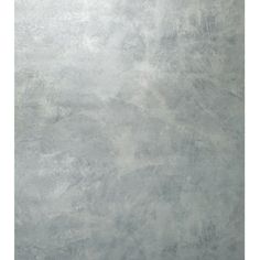 a gray wall with some white paint on it