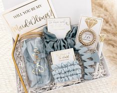 a gift box filled with blue and gold items