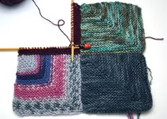 the knitting needles are next to two knitted squares