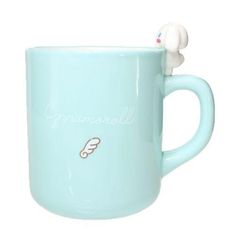 a blue coffee mug with a white bunny on it's head and the word grumpball written in cursive writing