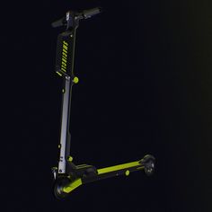 an electric scooter in the dark with its lights on and no wheels attached