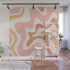 an orange and pink wall mural in a living room