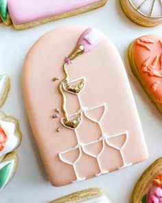 decorated cookies and pastries on a white surface