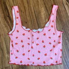 New Topshop Cropped Tank Is Pink With Red Lettuce Edges And A Strawberry Pattern. Size Small. Lightweight 97% Polyester 3% Elastane For Stretchy Comfortable Fit Approx 13.5” Pit To Pit Unstretched And 14.5” Shoulder To Hem Cute Sleeveless Top With Strawberry Print, Cute Sleeveless Strawberry Print Top, Cute Strawberry Print Tops For Spring, Red Strawberry Print Top For Summer, Cute Red Cotton Tank Top, Red Sleeveless Top With Strawberry Print, Sleeveless Red Top With Strawberry Print, Cute Fitted Tank Top For Spring, Casual Sleeveless Top With Strawberry Print