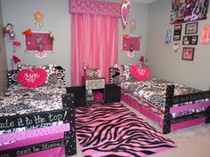 a bedroom with zebra print bedding and pink curtains