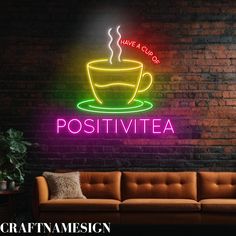 a neon sign that says, have a cup of positivitya