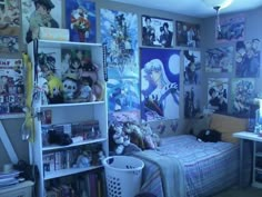 a bed room with a neatly made bed and lots of pictures on the wall