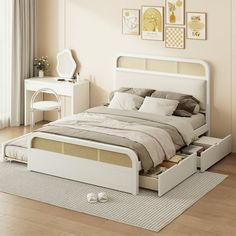 a white bed with drawers underneath it in a room