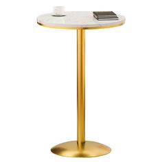 a white table with a gold base and a book on it's top, against a white background