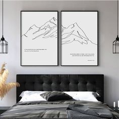 two black and white prints on the wall above a bed