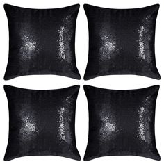 four black sequin pillow covers with white sparkles on the front and back of them