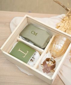 an open wooden box with personal items inside