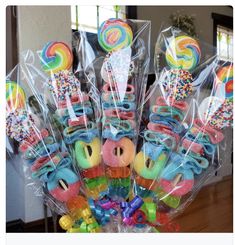 a bunch of lollipop candies in cello bags