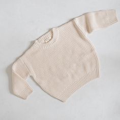 Oh, baby! This cable knit baby sweater has totally won us over. Oversized for a relaxed knit fit and reinforced with thick ribbed hemlines, our chunky knit baby sweater is a bon-a-fide dream come true. *THIS IS AN OVERSIZED KNIT SEATER IF YOU WANT A TTS FIT, SIZE DOWN 2 SIZES IF YOU WANT A BAGGY FIT, SIZE DOWN 1 SIZE IF YOU WANT A VERY LOOSE OVERSIZED FIT, STAY TRUE TO SIZE ** ALL SALE ITEMS ARE FINAL SALE Knit Baby Sweater, Bath Care, Oversized Knit Sweater, Knit Baby Sweaters, Sock Booties, Oversize Knit, Oversized Knitted Sweaters, Baby Sweater, Swim Sets