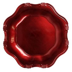 a red plate with ornate designs on the edges and sides, set against a white background