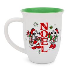 a white coffee mug with mickey and minnie on it's side that says noel