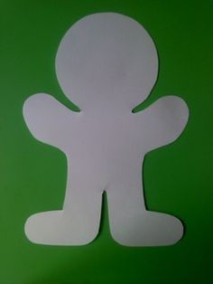 a paper cut out of a person on a green background