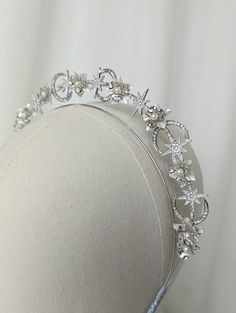 a white headpiece with flowers on it