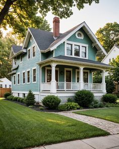 a blue house with white trim and windows