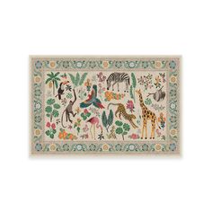 an animal rug with various animals and plants on the border, including zebras, giraffes, flamingos, and more