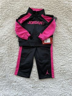 NWT  NikeJordan Jumpman Baby Toddler 2pc Jacket Pants Set Size 12M MSRP $ 60 Excellent condition Brand Nike Jordan Color Black/Pink Department Baby Size 12M 75-80cm Type outfit/Set Style Jacket/Pants Clothing, Shoes & Accessories>Baby>Baby & Toddler Clothing> Outfits & Sets Jacket: Shoulder 8 Bust 10 Front Length 10.5 Bottom Hem 10 Sleeve Length 10 Pants: Hips 9.5 Inseam 9 Outseam 14.5 Waist 8.5 Pay attention to pictures and measurements!  Please read details and view all pictures before bidding Nike Jumpsuit, Reborn Clothes, Type Outfit, Toddler Nikes, Clothing Outfits, Set Style, Toddler Clothing, Baby Outfits