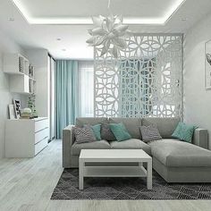 the living room is decorated in white and gray colors with blue accents on the walls