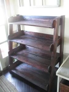 a wooden shelf sitting on top of a hard wood floor