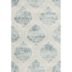 a blue and white rug with an ornate design on the bottom, in front of a white background