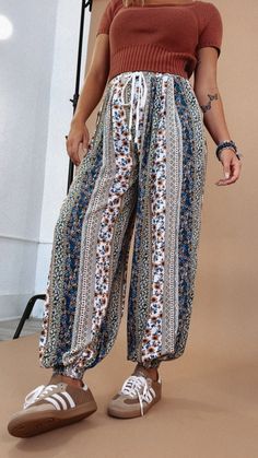 Be ready for anything with the versatile In The Mix Printed Boho Jogger! Made from light material, it's perfect for any occasion. With a stylish mixed boho print, it adds a playful edge to your look. Go ahead, dare to be different. Boho Joggers Mix print Vintage aesthetic Boho outfit inspo Measurements: (Approximate. Measured lying flat. **2-3" stretch in waistband.) S- Waist 28" Hip 46" Rise 11" Inseam 29" M- Waist 30" Hip 48" Rise 11 1/2" Inseam 29 1/2 " L- Waist 29" Hip 50" Rise 12" Inseam 30" Model Specs: Emily is wearing a size small in the photo.How will this item fit you? Check out our MODEL SPECS (Typical Sizing - Karli: S-Size 5/26 - 5ft 2in, Emily: S-Size 3/25 - 5ft 5in, Syd: L/XL- Size 15/ - 5ft 8in)Need help with sizing? No problem! Join our VIP group on Facebook, Everyday Chic Non-stretch Boho Print Bottoms For Summer, Cotton Wide-leg Pants With Boho Print, Bohemian Non-stretch Bottoms With Boho Print, Non-stretch Multicolor Bohemian Pants, Bohemian Printed Wide-leg Pants, Style Wide Leg Jeans, Bride Top, Everyday Chic, Exclusive Dress