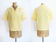 "Vintage 1950s women's light yellow and cream gingham plaid blouse Blouse has a simple double notched collar and cuffed short sleeves. Buttons down the front. No tags Material: Unknown, manmade and very crisp (may be deadstock)  Best fit: S/M Good vintage condition  Length: 21\" Chest: 38\" Shoulder: 15.5\" Sleeve: 9\"" Vintage Gingham Blouse For Spring, Spring Vintage Gingham Blouse, Vintage Gingham Blouse For Summer, Vintage Gingham Summer Blouse, Summer Vintage Gingham Blouse, Vintage Gingham Cotton Blouse, 1950s Shorts, 1950s Woman, Yellow Gingham