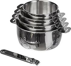 a set of five stainless steel pots and pans with tongs on the side