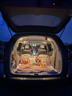 the trunk of an suv is filled with stuffed animals