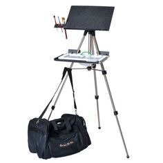 an easel and bag are sitting on a tripod