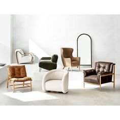 an assortment of modern chairs and mirrors in a room with white walls, flooring and concrete floors