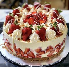 a cake with strawberries and cream on top