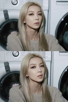 a woman with long blonde hair sitting in front of a washing machine