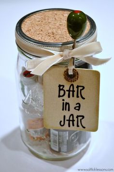 a jar filled with lots of different types of items and labeled bath in a jar