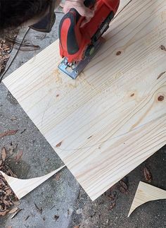 a person using a power tool to cut wood