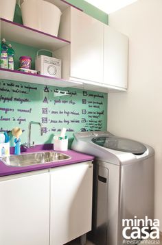 a laundry room with a washer and dryer next to a sink in front of a washing machine