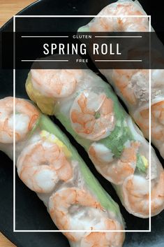 shrimp spring rolls on a black plate with a white square frame over it and the words, gluten spring roll