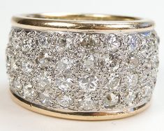 an image of a wedding ring with many diamonds on it's sides and in the middle