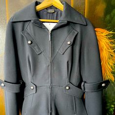 Used Fendi Coat - 100% Wool. Black. European Size 44, But Would Be Closer To A Us Size 6. Coat Has A Zipper Closure And Sleeves Are Cuffed. Slanted Breast Pockets With Button Closure. Coat Is Pleated In The Back And Has A Collar. Coat Is In Very Good Condition. Designer Wool Outerwear With Concealed Placket, Gabardine Button-up Outerwear With Button Cuffs, Fendi Coat, Gabardine Button-up Outerwear With Hidden Button Closure, Luxury Women's Wool Coat With Double-breasted Button Fastening, Long-sleeve Gabardine Outerwear With Hidden Button Closure, Wool Coat, The 100, Fendi