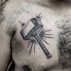 a man with a hammer tattoo on his chest