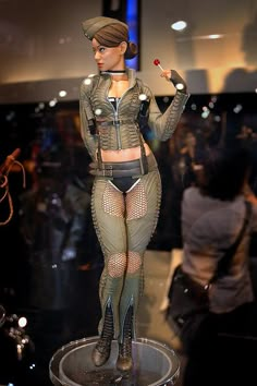 a mannequin is displayed in front of a group of people